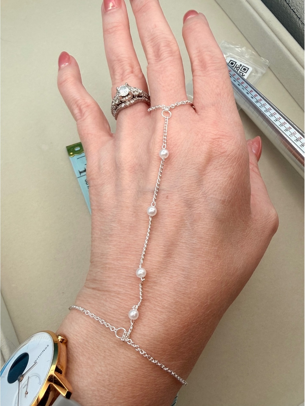 Silver tone pearl hand chain bracelet